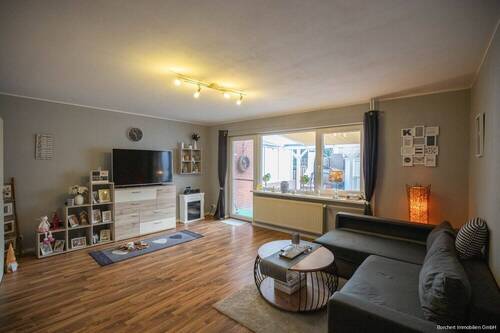 Wohnzimmer - Reihenmittelhaus mit 74,20 m² in Kremperheide zum Kaufen