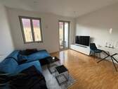 Offener Wohn- und Essbereich - Stilvolle 2-Zimmer-Neubauwohnung im Neubauensemble mit Balkon, Aufzug & TG-Stellplatz