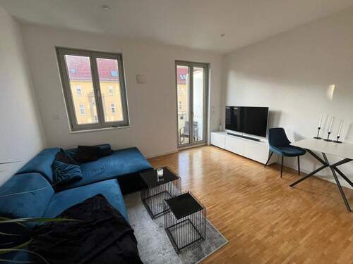 Offener Wohn- und Essbereich - Stilvolle 2-Zimmer-Neubauwohnung im Neubauensemble mit Balkon, Aufzug & TG-Stellplatz