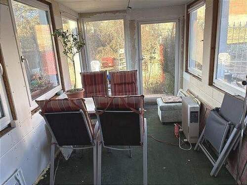 Wintergarten mit Zugang zum Garten - 