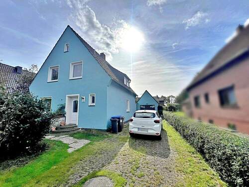 Außenansicht mit Garage - Einfamilienhaus mit 120,00 m&sup2; in Berne zum Kaufen