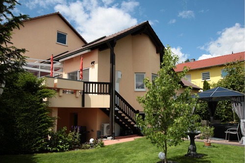 Ansicht vom Garten - Mehrfamilienhaus, Wohnhaus mit 416,00 m&sup2; in Poppenhausen zum Kaufen