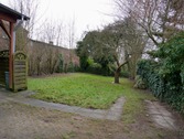 Ansicht auf den Garten hinterm Haus - 9 Zimmer Mehrfamilienhaus, Wohnhaus zum Kaufen in Marne