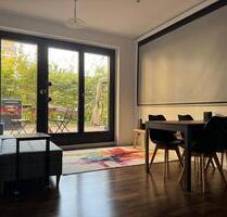 Möblierte Wohnung mit Garten über der Mall of Berlin
