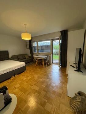 Foto - Stilvoll möblierte 1-Zimmer-Wohnung mit Gartenterrasse und separater Küche