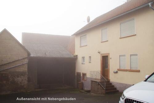 Foto - Einfamilienhaus, mit großem unterkellertem Nebengebäude.