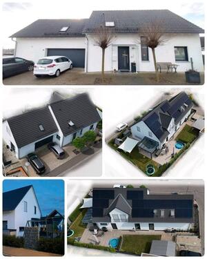 Foto - Modernes freistehendes Haus mit Einliegerwohnung und PV-Anlage