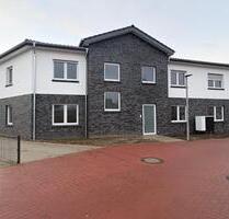 Neubau 3 Zimmer Erdgeschosswohnung mit Terrasse, Gartenanteil und EBK - Harpstedt