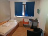 Foto - Ein Zimmer in einem Gasthof auf Zeit.