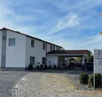 Mehrfamilienhaus + Gewerbeeinheit auf 2.343 m² Grundstück - Northeim