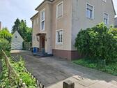 Foto - Erdgeschosswohnung mit Garten, Garage und Wintergarten