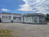 Foto - Wohn- und Geschäftshaus mit Fahrzeughalle