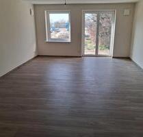 Neubau – Erstbezug! Moderne EG-Wohnung mit Terrasse & Tiefgarage - Grasberg