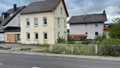Foto - Einfamilienhaus mit Geschäft und Anbau Bauplatz