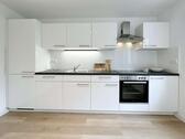 Foto - Erstbezug nach Sanierung: Moderne 2-Zimmer-Wohnung mit Terrasse, Einbauküche & PKW-Stellplatz