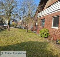 M 03 SCHWANEWEDE - 5 Zimmerwohnung im Erdgeschoss mit zwei Garagen in ruhiger Lage-