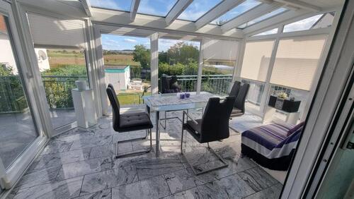 Foto - Hochwertige 3-Zimmer-Wohnung mit Wintergarten, Kamin und Garten