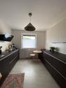 Foto - 3 Zimmer Wohnung Balkon EBK Garage mit Wallbox Garten