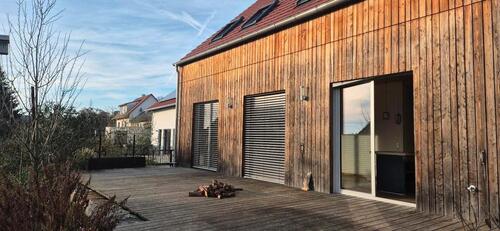 Foto - Vollhollzhaus mit Lärchenverschalung