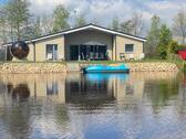 Foto - Last Minute, Ferienhaus am See (1-8 Pers.) mit Panorama Außen Sauna, Tretboot, Whirlwanne, Kamin, Kinderspieleparadies