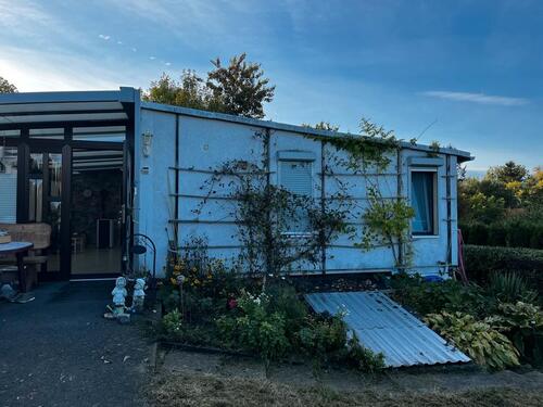 Foto - Einfamilienhaus im Bungalowstil mit Gartengrundstück