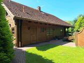Foto - **Holzhaus mit Doppelgarage und Gestaltungspotenzial nahe HH**
