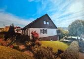 Foto - Einfamilienhaus mit vermieteter Dachgeschosswohnung