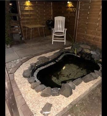 Foto - Kleingarten mit massiver Gartenlaube