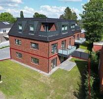 Erdgeschosswohnung mit Küche, eigenem Garten, PV Anlage & Wärmepumpe! - Westoverledingen