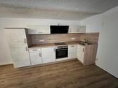 Foto - Viersitzig einer 1- Zimmer Wohnung, Küche, Bad