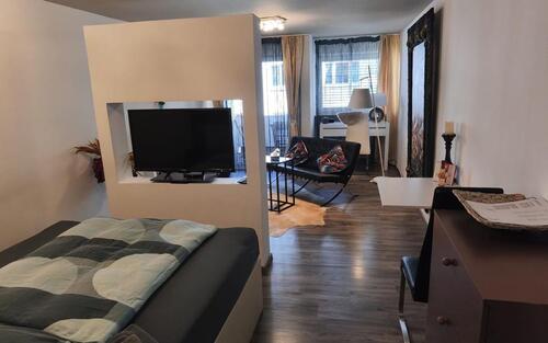 Foto - 1-Zimmerwohnung, Design, mit Internet, TV, Küche, Balkon, Boxspringbett, Waschmaschine und Trockner – löffelfertig, stilvoll und komfortabel wohnen auf Zeit.