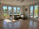 Foto - Moderne helle Wohnung mit großer Terrasse und Gartenblick