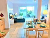 Foto - Ferienapartment Flut in Schönhagen an der Ostsee 2+2 Personen 1 Lebensraum mit Doppelbett Wohnlandschaft Essbereich Küchenzeile DU-Bad TV Sonnenterrasse Strand Meer Fjord Ostsee