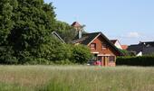 Foto - Honka-Blockhaus mit Specksteinofen - Wohnen im Grünen