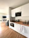 Foto - Möblierte 1-Zimmer-Neubauwohnung mit Südterrasse und Gartenanteil