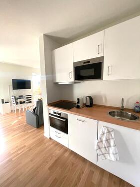 Foto - Möblierte 1-Zimmer-Neubauwohnung mit Südterrasse und Gartenanteil