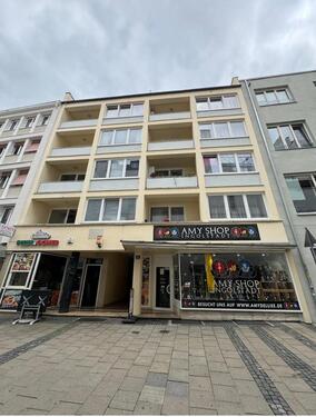 Foto - Ein Mehrfamilienhaus steht zum Verkauf