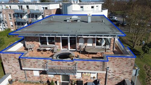 Foto - DAS BESONDERE Altengerechte Penthousewohnung mit Kachelofen und Dachterrasse