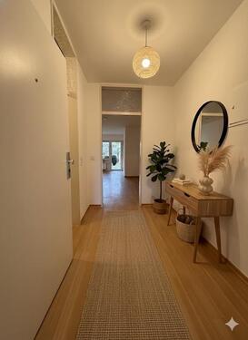 Foto - 3-Zimmer-Wohnung mit Terrasse, kleinem Garten und offenem Wohn-Essbereich im Untergeschoss