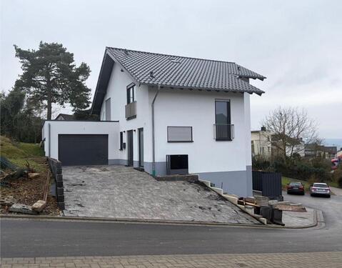 Foto - Einfamilienhaus mit Einliegerwohnung+zusätzlichem Wohnraum