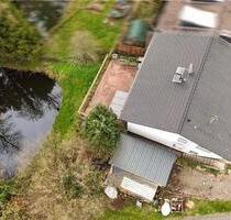Einfamilienhaus in Much mit 1.670 m² Grundstück, Naturteich, Bach