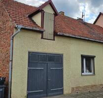 Einfamilienhaus mit kl. Garten als Kapitalanlage o. Eigennutzung - An der Schmücke