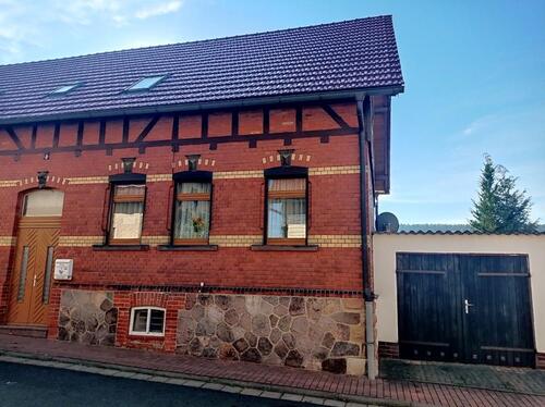 Foto - Doppelhaushälfte (Einfamilienhaus) mit Garage und sonnigem Garten