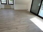 Foto - Moderne Dachgeschosswohnung mit Garten