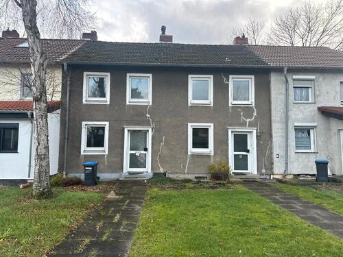 Foto - Zwei sanierungsbedürftige Reihenmittelhäuser nebeneinander