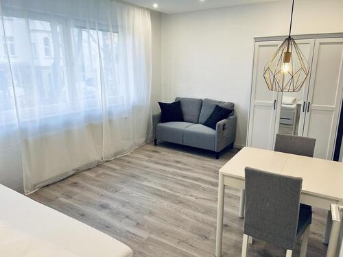 Foto - Moderne vollmöblierte 1-Zimmerwohnung mit Blick in die Stadt