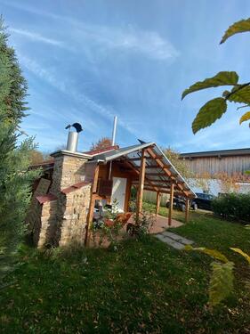 Foto - Erschlossener Baugrund (Kleines Holz Haus ) zu Verkaufen