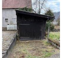Garage mit kleinem Garten Freizeitgrundstück in Niederbreitbach - Straßenhaus