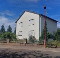 Einfamilienhaus mit großem Grundstück und Garage in Ockenheim