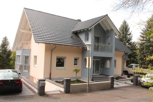 Foto - Modernes Einfamilienhaus mit Einliegerwohnung